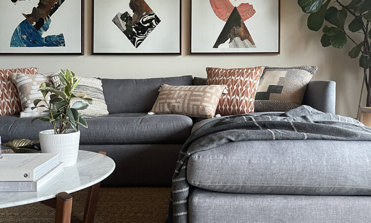 Airbnb living room with bold artwork and a comfortable sectional